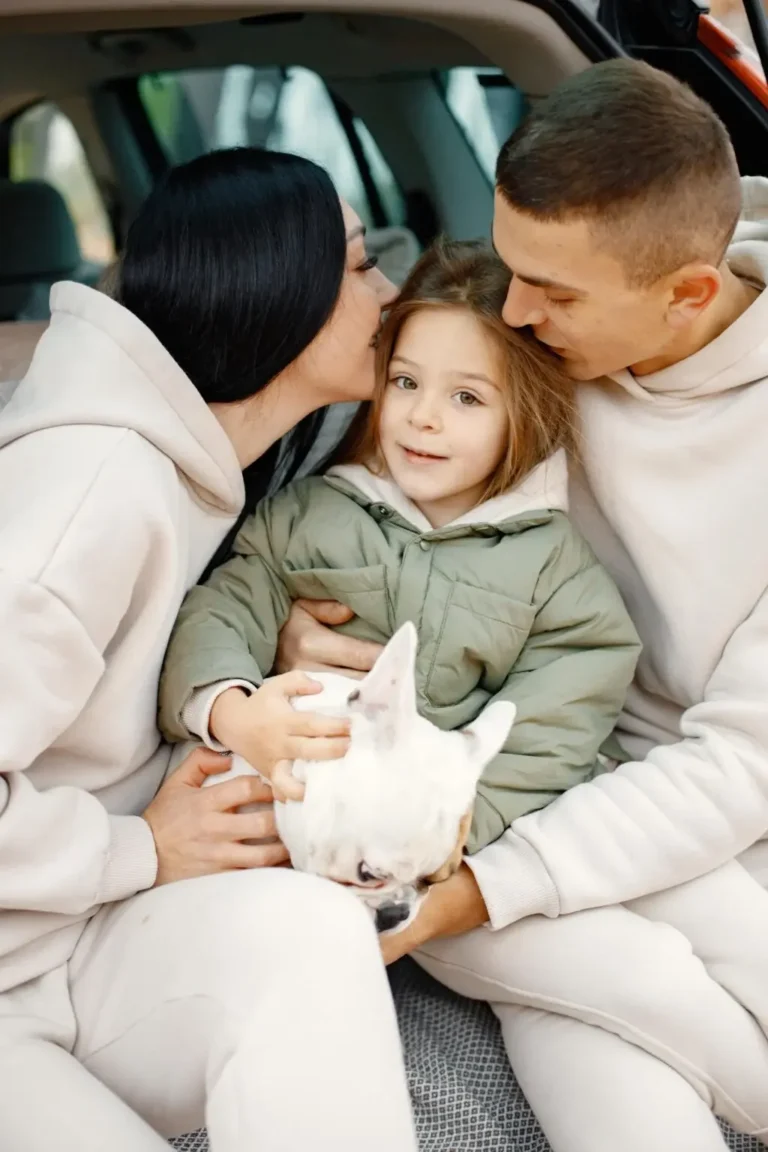 family resting after day spending outdoor father mother their daughter dog sitting inside car trunk family wearing beige sportive costumes min 1 1024x1536 1