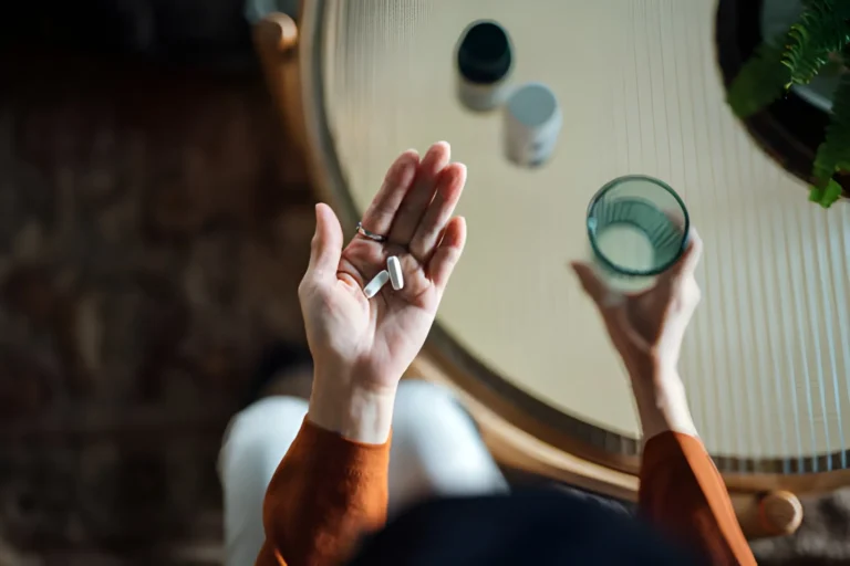 Patient talking to doctor in hospital room with supplemental insurance covering hospital and treatment costs
