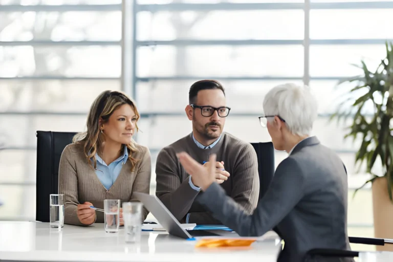 Family consulting InsuredHealth advisor about Life Insurance coverage options