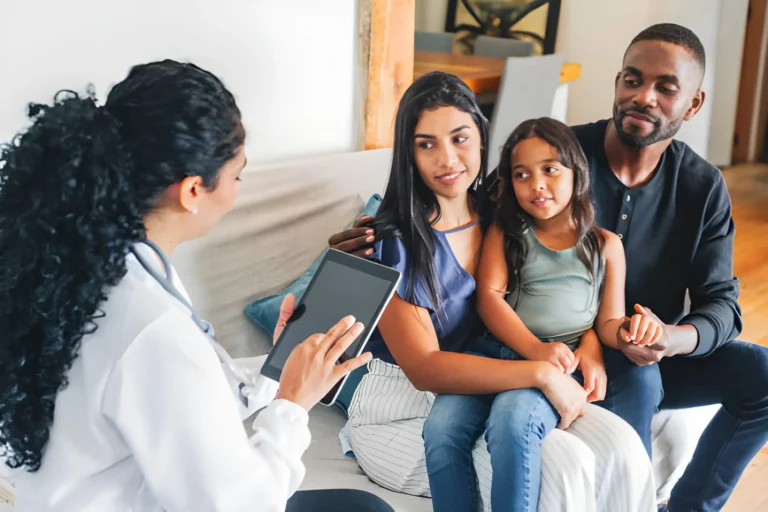 Family reviewing Health Insurance Missouri options in a living room in Missouri